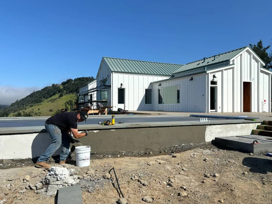 Exterior stucco finish being applied to raised Calistoga pool walls