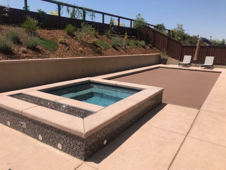 Rectangular pool with spa showcasing structural upgrades