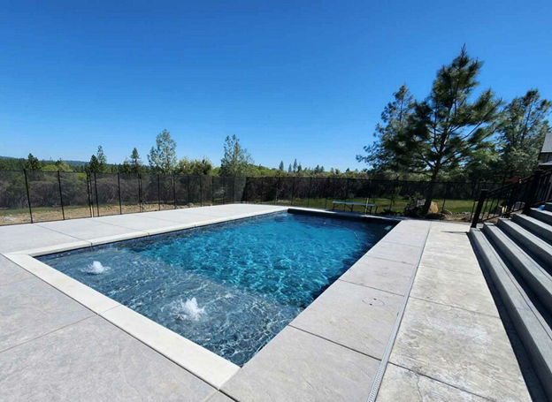 A rectangular pool with two bubblers on Cabo shelf in Nevada City.